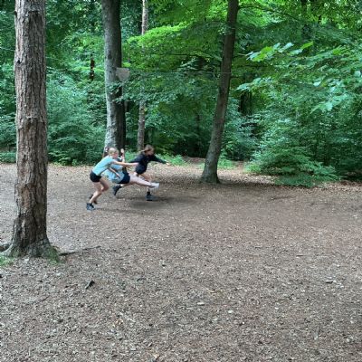 Child on zip line and children running